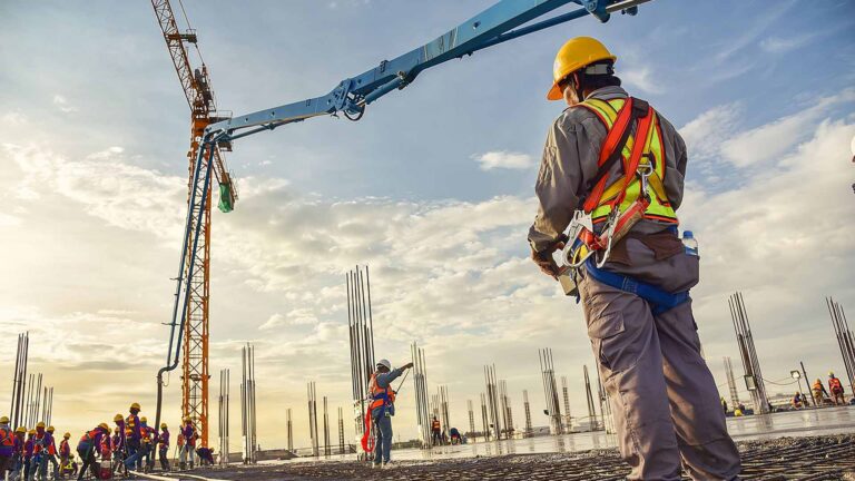 Construction workers building a warehouse