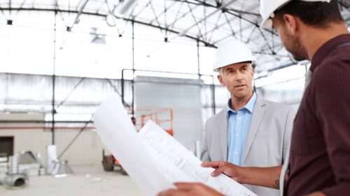 two engineers discussing how to set up a warehouse